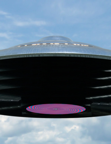 A graphic of a pile of records as a spaceship against a blue sky.